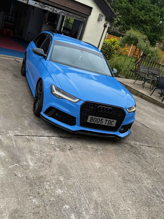 Bright blue Audi RS6 Avant on a driveway