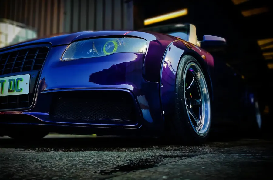 Low angle shot of a purple widebody Audi