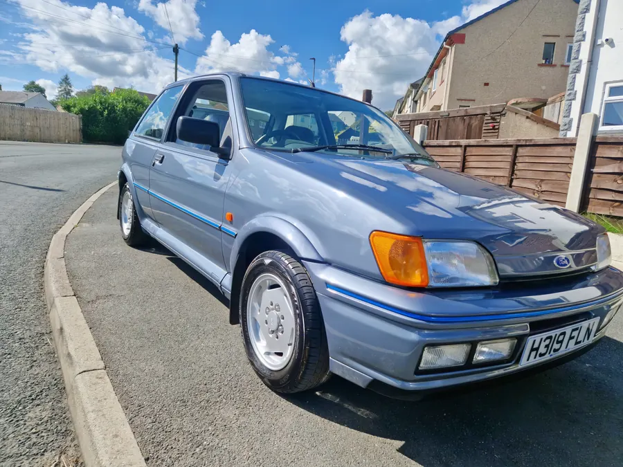 Silver-blue Ford Fiesta Mk3 parked on a street