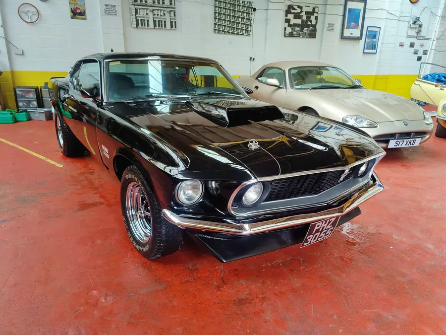 Black Ford Mustang Boss 429 in a showroom