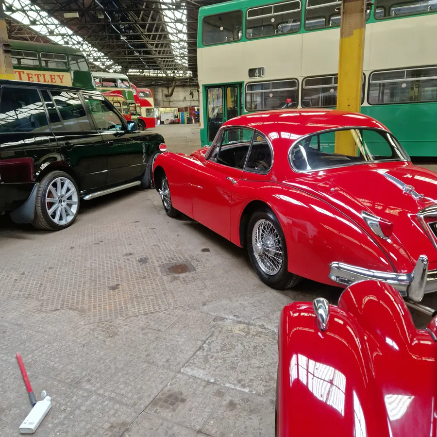 Red classic Jaguar coupé with a high gloss finish