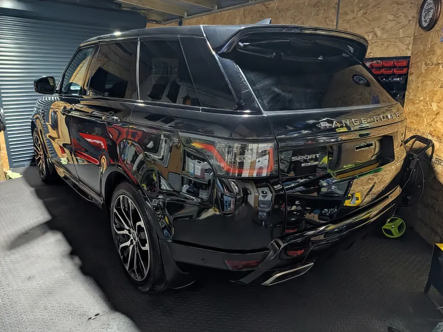 Black Range Rover Sport inside the workshop