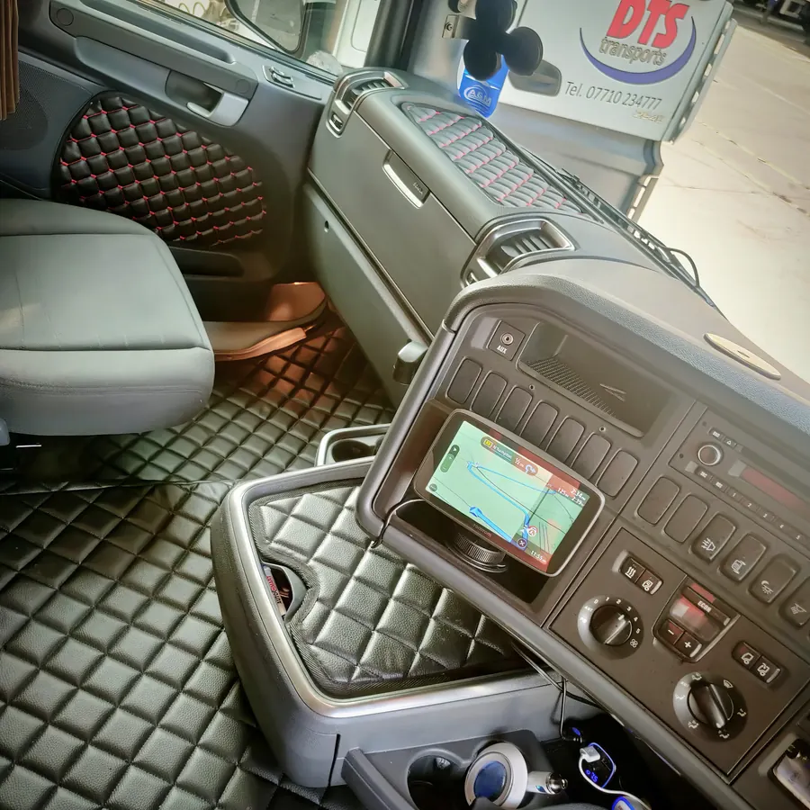 Clean lorry cab interior with quilted floor mats
